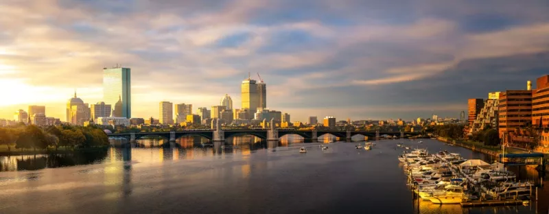 The Boston skyline against a sunset.